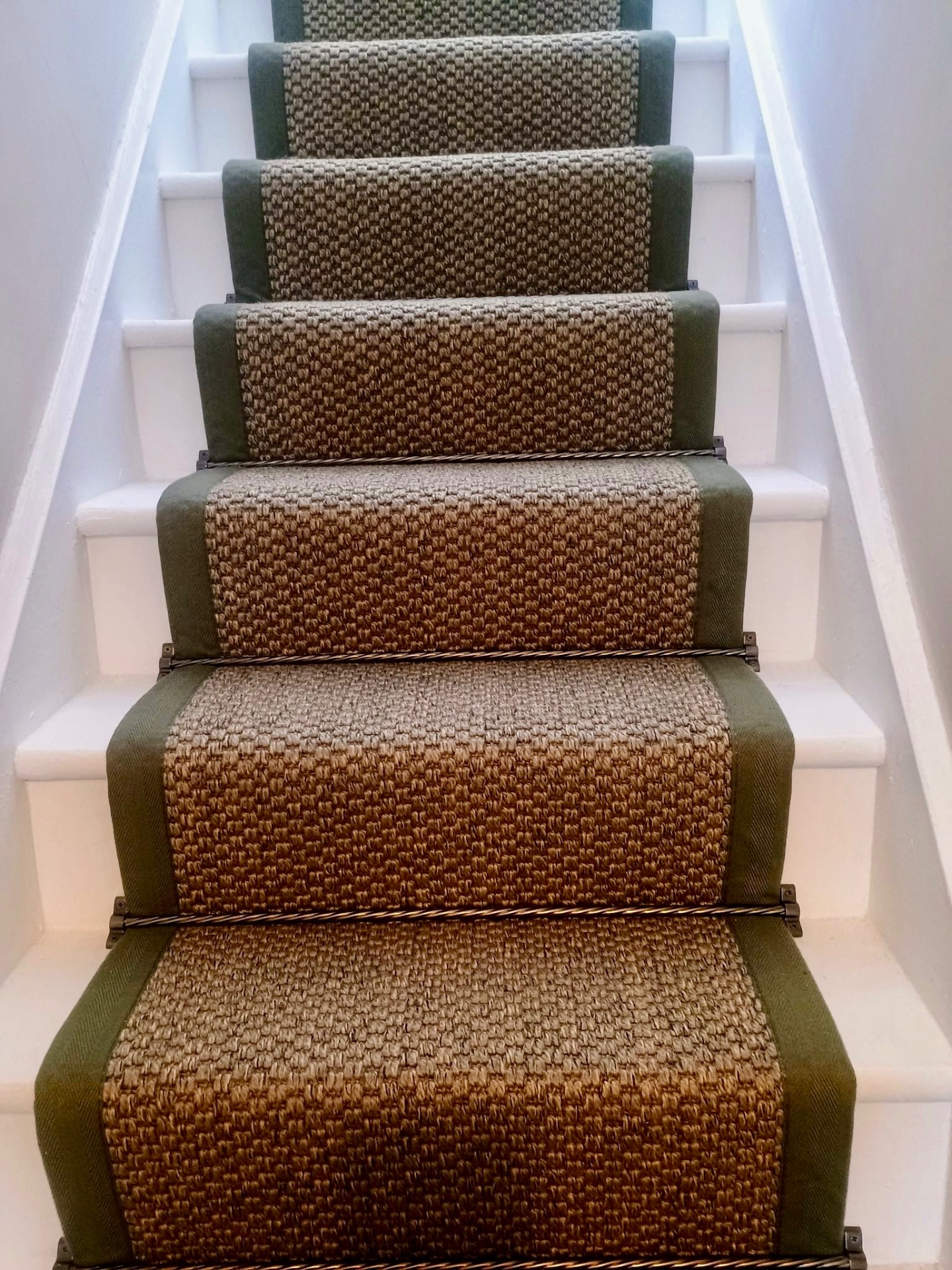 Freshly fitted grey carpet on a staircase
